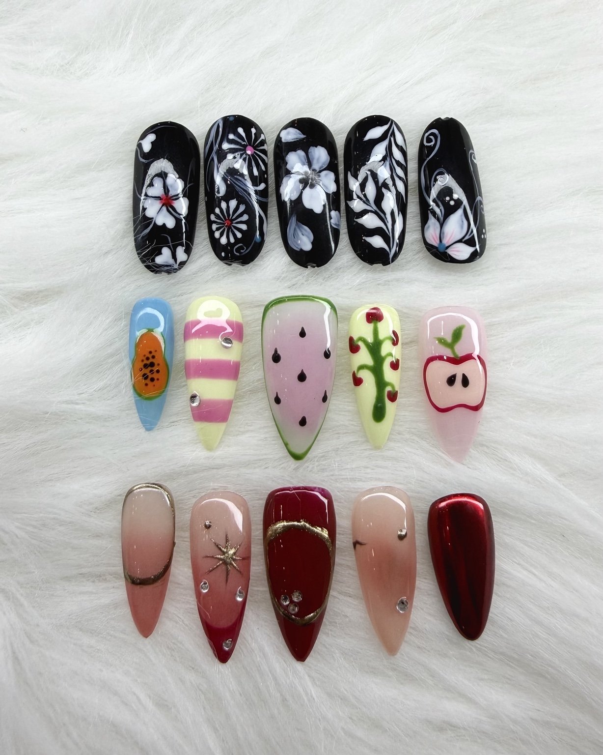 Black floral and fruit nail art